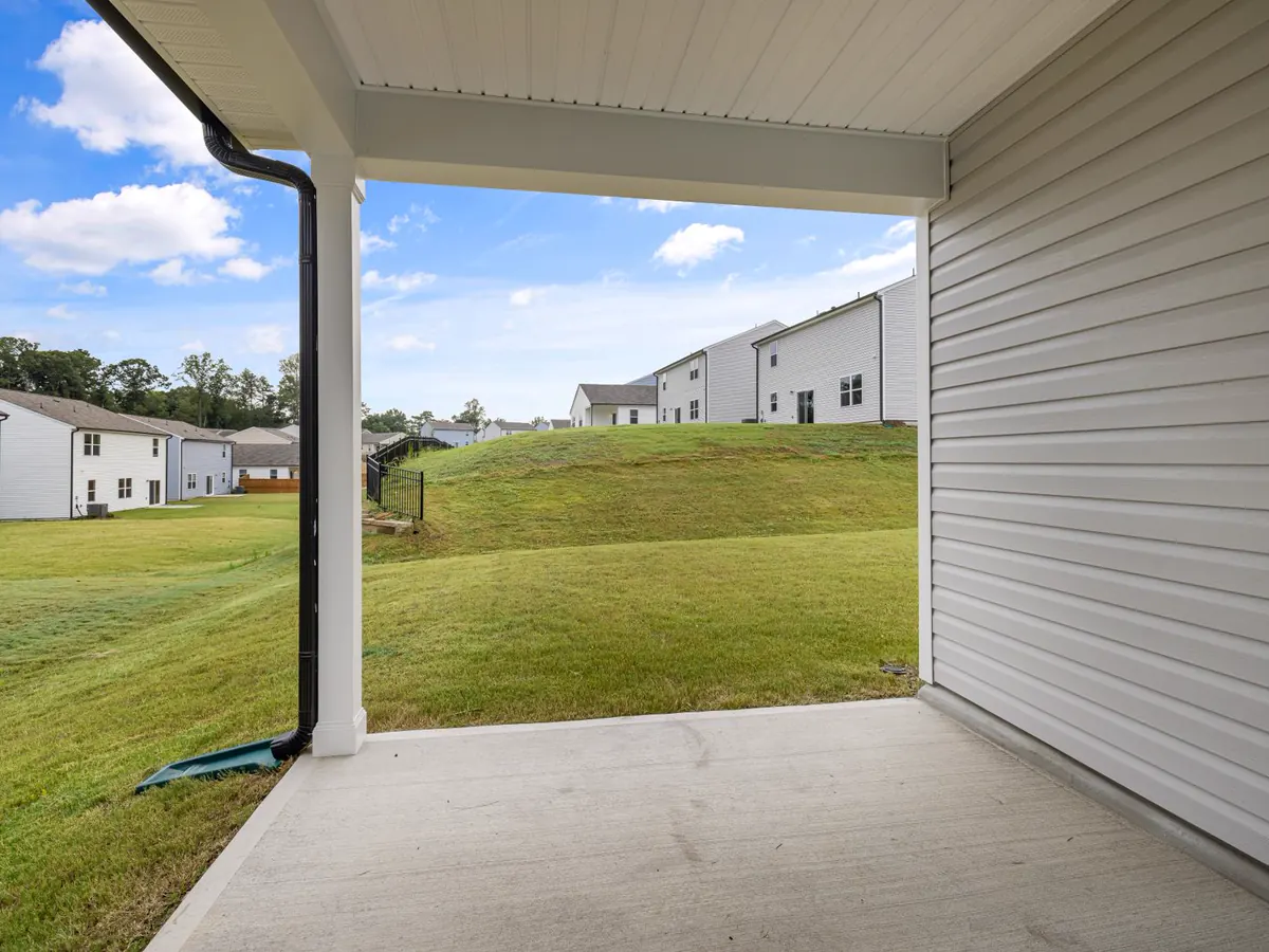 Concrete patio beside a modern home