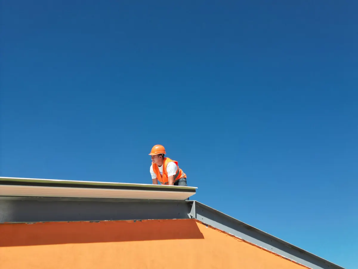 Roofing professional inspecting a roof edge