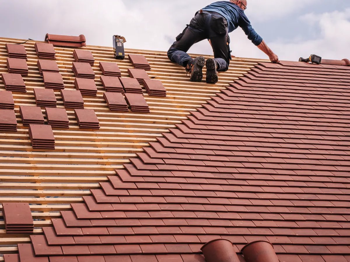 Roofing crew installing a residential roof